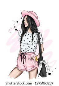 Beautiful girl in a stylish hat, t-shirt and shorts. Summer clothes. Fashion & Style. Vector illustration for greeting card or poster.