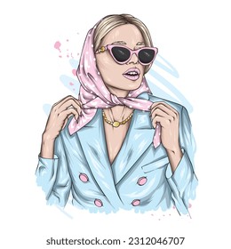 A beautiful girl in a stylish headscarf and glasses. Fashion and style, clothing and accessories.