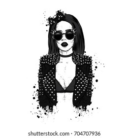 A beautiful girl in a stylish jacket and glasses with spikes. Vector illustration. Fashion & Style. Rock.