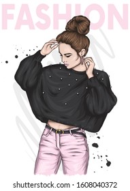 Beautiful girl in a sweater and trousers. Woman with a stylish haircut. Vector illustration for a card or poster, print on clothes.