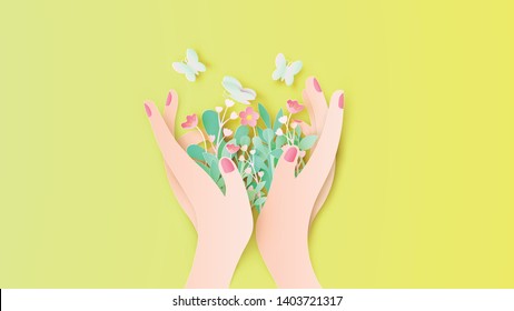 Beautiful girl's hand holding flower bouquet with butterflies flying around. Women and flower. paper cut and craft style. vector, illustration.