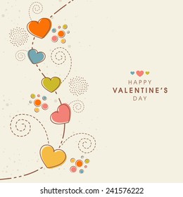 Beautiful greeting card decorated by colorful hearts and floral design for Happy Valentine's Day celebration.