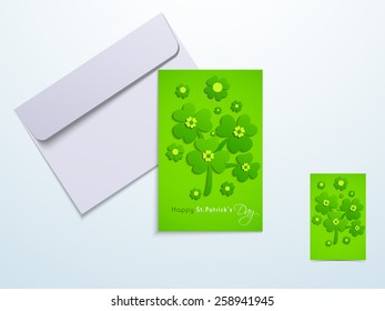 Beautiful greeting card design decorated with Irish lucky shamrock and clover leaves with envelope for Happy St. Patrick's Day celebration.