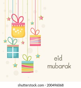 Beautiful greeting card design with hanging colorful gift boxes and stars on beige background  for Muslim community festival Eid Mubarak celebrations.  