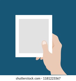 A beautiful hand grabbing a blank polaroid pictures template flat vector illustration. Set of pictures in one hand reminds lots of memories isolated background. - Powered by Shutterstock - Get 15% off with code: PIKWIZARD15