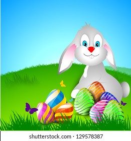 Beautiful Happy Easter concept with smiling bunny, colorful painted eggs and butterflies on nature background.