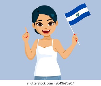 Beautiful happy smiling Salvadoran woman holding El Salvador Flag making pointing hand gesture