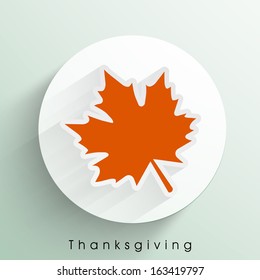 Beautiful Happy Thanksgiving Day celebrations sticker, tag or label wit orange autumn leaf. 
