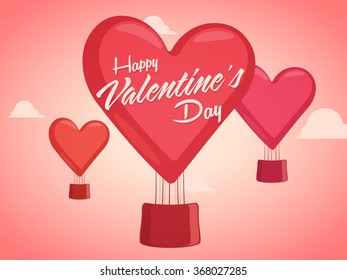 Beautiful heart shaped hot air balloons flying on glossy cloudy background for Happy Valentine's Day celebration.