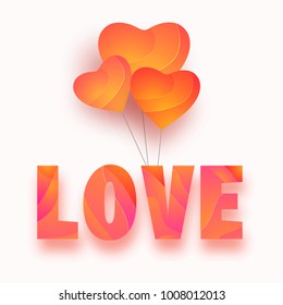 Beautiful heart shapes balloon with text Love on white background. 