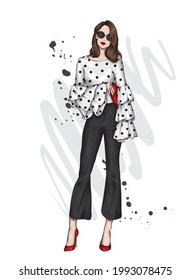 Beautiful high in pants and a shirt. Stylish clothes and accessories. Fashionable woman. Vector illustration. Fashion and Style. Fashion look.  - Shutterstock ID 1993078475