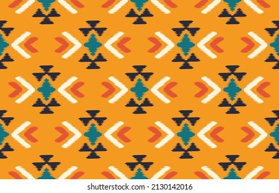 Beautiful ikat art. Ethnic Seamless pattern chevron, folk embroidery, and abstract art. Aztec geometric chevron ornament print. Design for carpet, wallpaper, clothing, wrapping.Orange background