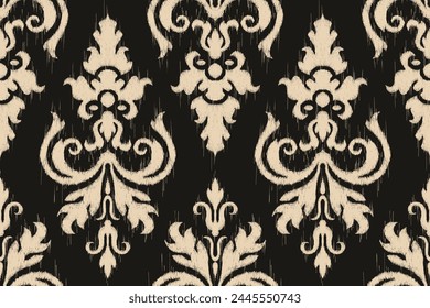 Beautiful Ikat paisley embroidery on black background.geometric ethnic oriental seamless pattern traditional.Aztec style abstract illustration.design for texture,fabric,clothing,wrapping,carpet.