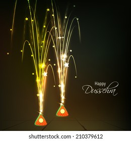 Beautiful images of red burning crackers and with spreading bright light and stars in night view background.