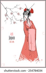Beautiful Japanese girl in traditional dress. Japanese woman in kimono.
