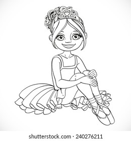 Beautiful little ballerina girl in dress sit on floor outlined