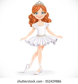 Beautiful little brunette ballerina girl in tiara stand on a white background