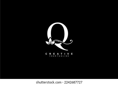 beautiful luxury logo design initial white letter Q with gorgeous flourish ornament. monogram typography letter Q with gold leaf and floral ornament decoration