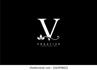 beautiful luxury logo design initial white letter V with gorgeous flourish ornament. monogram typography letter V with gold leaf and floral ornament decoration