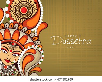 Beautiful Maa Durga Face with Stylish text on shiny background for the celebration of Durga  Pooja or Shubh Dusshera.
