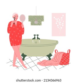 Beautiful mature woman standing in her bathroom and massaging her face with a facial roller. Daily morning skincare routine. Vector flat illustration