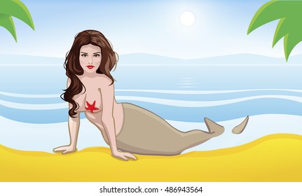 Beautiful mermaid with dark hair lying on the beach