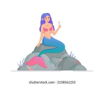 A beautiful mermaid sits