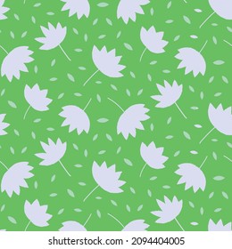 Beautiful minimal leaves seamless pattern white silhouette  on green background . Great for fashion, fabric, home décor and wallpaper 