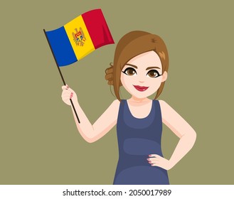Beautiful Moldovan woman waving Moldova flag with hand on hip