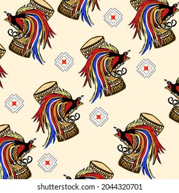 Beautiful motif of Papua batik with bird of paradise pattern and tifa musical instrument.
