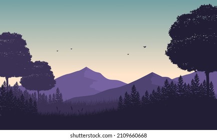 Beautiful mountain scenery with dry tree silhouettes with an expanse of the lake