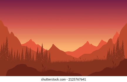Beautiful mountain view of the forest at dusk with fantastic dry tree silhouette