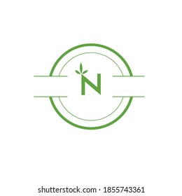 Beautiful N Nature logo design eco bio and green leaves vector symbols fresh healthy health sign.