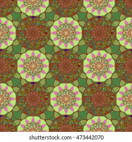 Beautiful new coloful stained glass kaleidoscope on a background of leaves seamless pattern for new design.