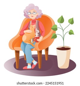 Beautiful old lady in glasses sitting in an armchair petting a cat and holding a cup