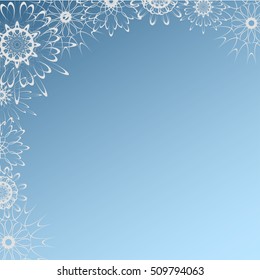 Beautiful  openwork frame of snowflakes on a blue background.