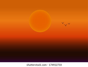 Beautiful orange sunset with a large sun and a flock of birds