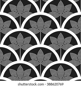 Beautiful oriental tiled black and white seamless pattern of half-circles with dotted lotus flower and decorative border. Japanese style fish-scale grid background. Vector illustration.
