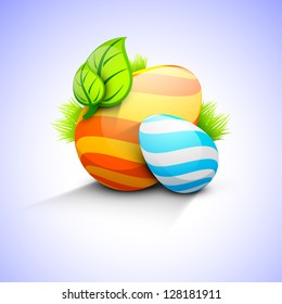 Beautiful painted Easter eggs with green leaves.