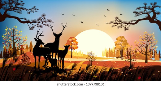 Beautiful panorama landscapes of Countryside in autumn, Panoramic of mid autumn with sunset, Silhouette of deers in the forest during autumn season