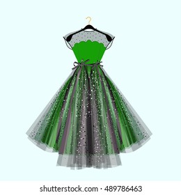 Beautiful party dress. Green dress with rhinestones. Vector fashion illustration. Dress for special event.