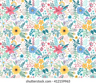 Beautiful pattern in small abstract flower. Small colorful flowers. White background. Spring floral background. The elegant the template for fashion prints.