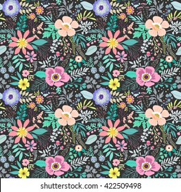 Beautiful pattern in small abstract flower. Small colorful flowers. Black background. Small cute simple spring flowers. The elegant the template for fashion prints.