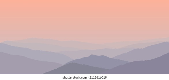 Beautiful pink sunset over the foggy mountains.