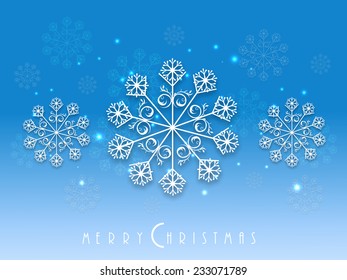 Beautiful poster or banner for Merry Christmas decorated with snowflakes on shiny blue background.