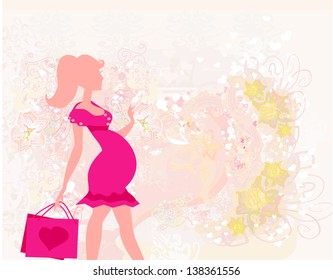  Beautiful pregnant woman on shopping - card