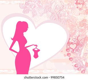Beautiful pregnant woman on shopping for her new baby- abstract background