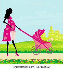  beautiful pregnant woman pushing a stroller