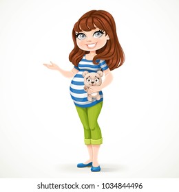 Beautiful pregnant woman in a striped T-shirt is holding a teddy bear in her hand and something tells it pointing to the side isolated on a white background