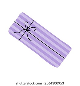 Beautiful purple gift wrapped in striped paper with a delicate bow tied on top